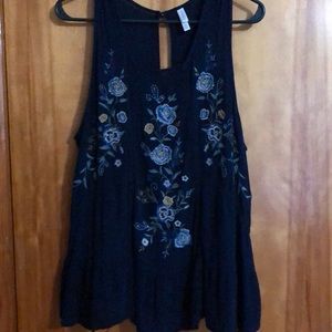 Navy blue tank top with blue and yellow flowers.